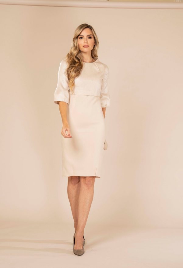 Ivory Wool slim-fitting A-line wool dress. This silhouette and an elegant boat neck.